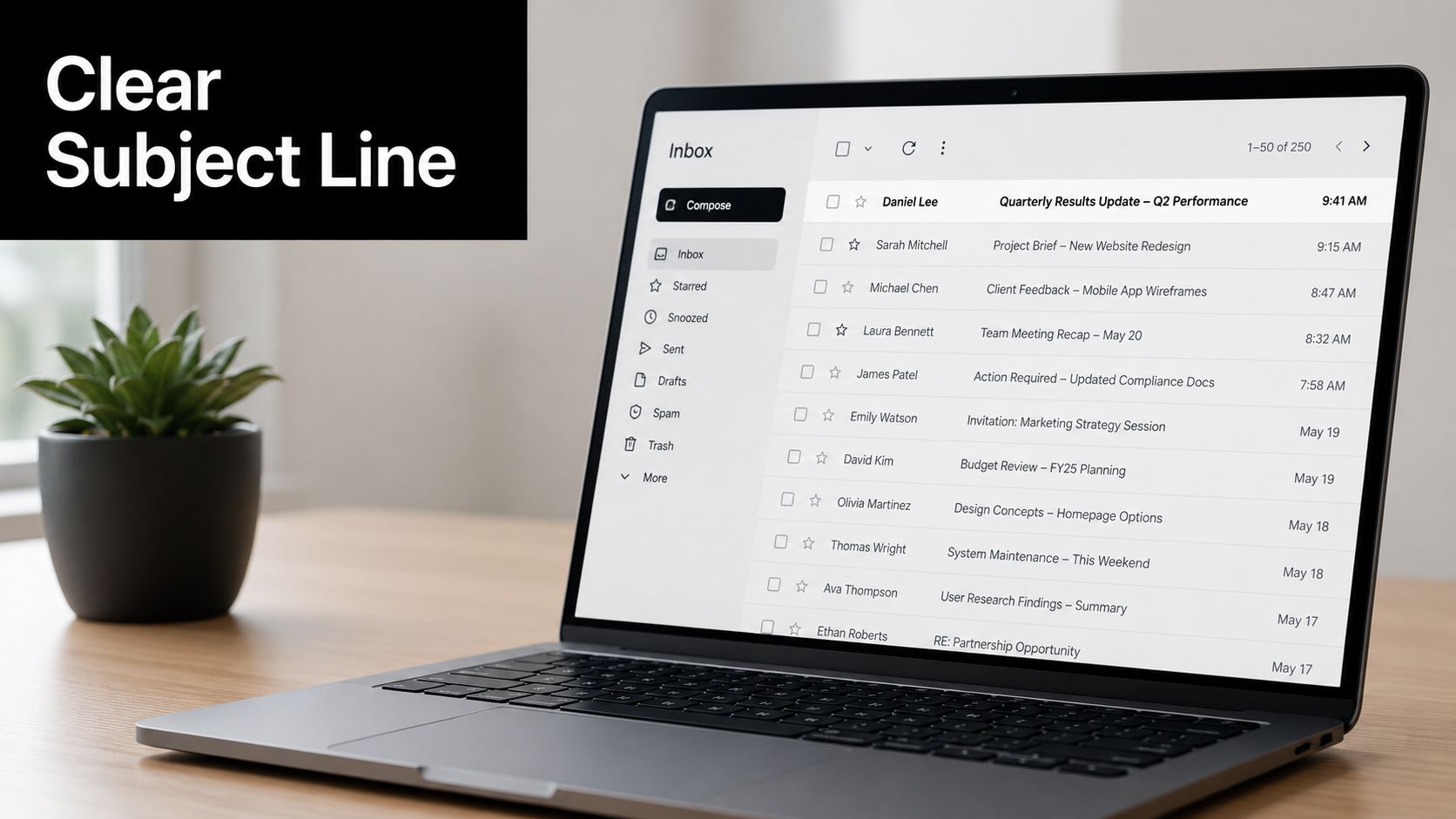 A modern laptop on a wooden desk displaying an open email inbox with clear subject lines.